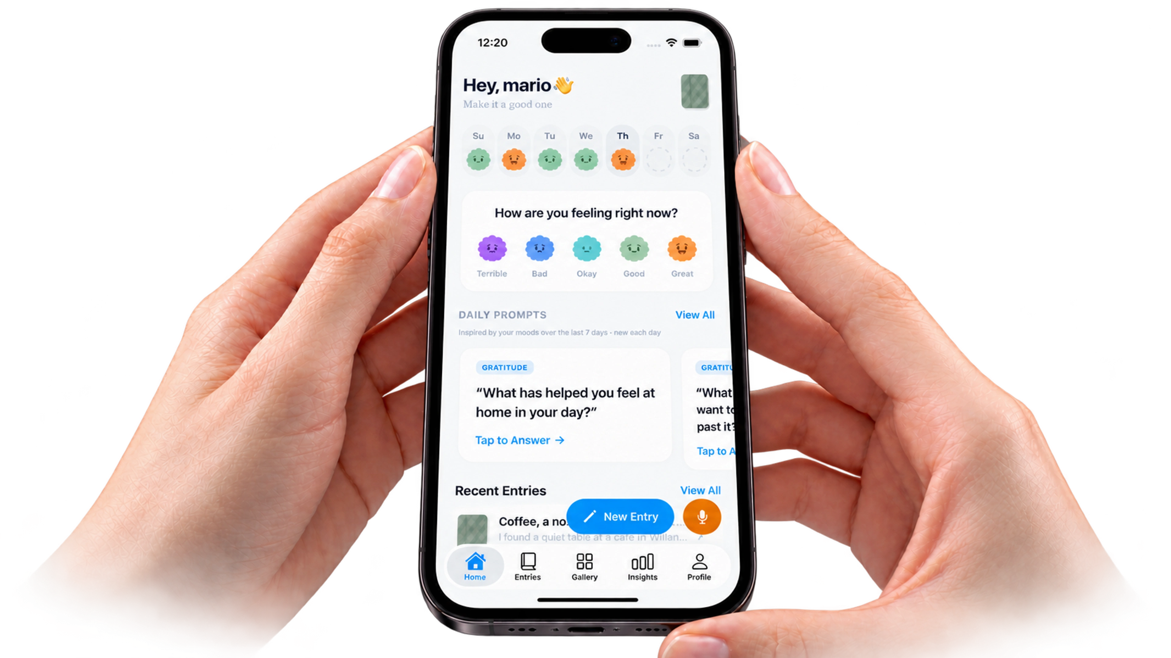 Jourlo’s home screen with mood check-ins and daily prompts on an iPhone held in two hands